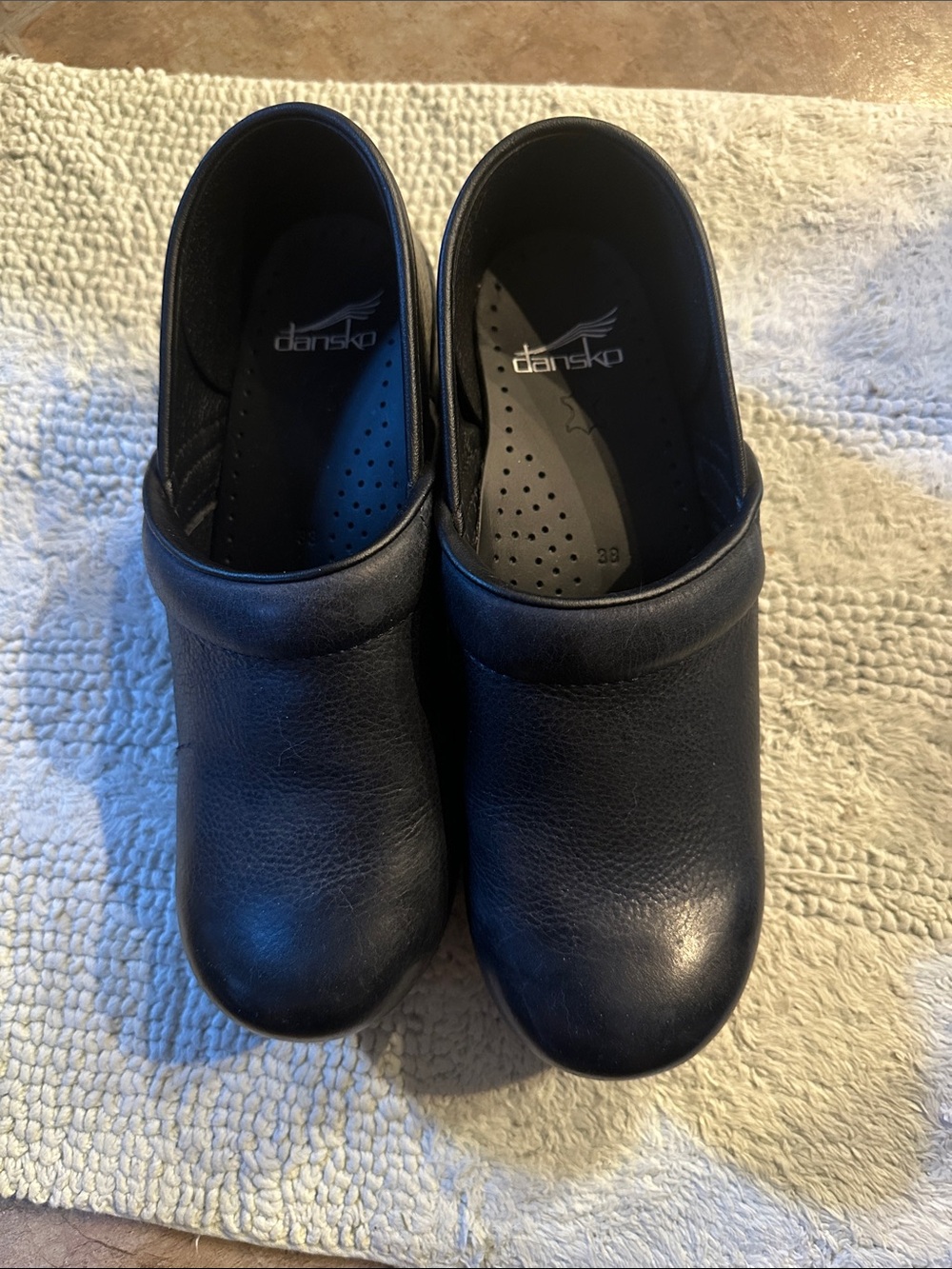 Dansko women’s navy blue Leather Slip-On Clogs